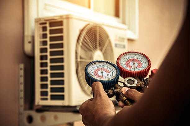 Professional Air Conditioning Service technician working in Mulino, OR